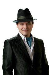 An elegant man in a suit and hat