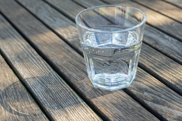 glass of water on the wood table