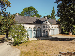 Fototapeta na wymiar The 18th century coach house in the Roosendael abbey public park in Walem, near Mechelen, Belgium
