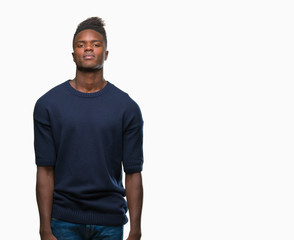 Young african american man over isolated background with serious expression on face. Simple and natural looking at the camera.