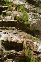 A thin stream of water on the dried waterfall Wuchang-su, Crimea June 2018