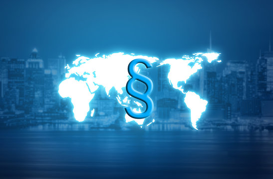 Digital paragraph law symbol over world map hologram and blurred city background