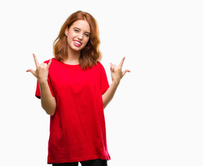 Young beautiful woman over isolated background shouting with crazy expression doing rock symbol with hands up. Music star. Heavy concept.