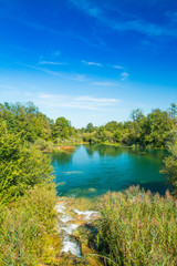 Fototapeta na wymiar Mreznica river in Belavici village, Karlovac county, Croatia, waterfall and green nature