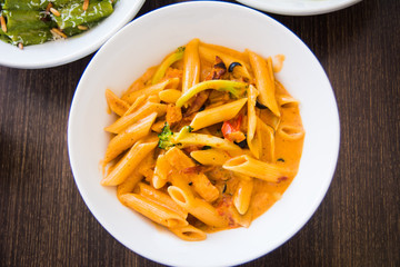 Chicken pasta on a plate top view