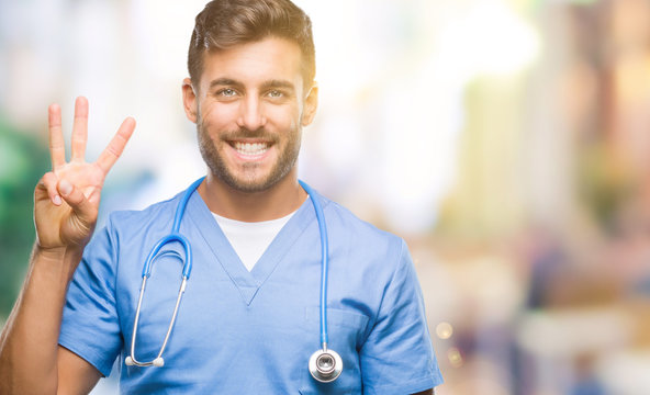 Young handsome doctor surgeon man over isolated background showing and pointing up with fingers number three while smiling confident and happy.