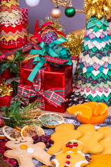Festive Gingerbread Characters.  Selection of festive decorated Christmas Gingerbread characters surrounded by presents and gifts.