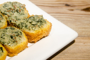 Weathered sushi roll with rockefeller sauce