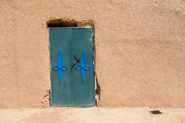 Traditional house and door in the desert of Morocco.