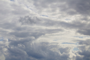 Cheery Bright White Fluffy Swirling Cumulus Storm Clouds Building Around Blue Sky Tunnel With Sunny Silver Lining Natural Cloudscape Nature Background Texture