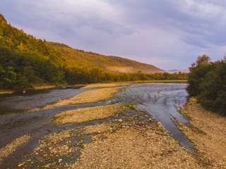 landscape view, mountains on sunset with fig and river
