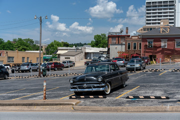 Vintage black car in downtown public parking
