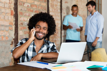 Smart african american hipster software developer at office