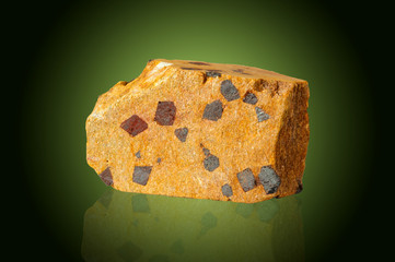 the mineral magnetite on a green background