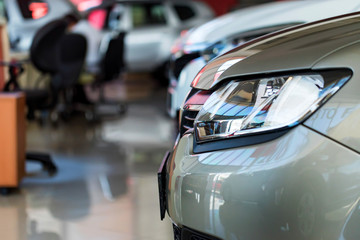 Interior of car dealer showroom with new cars