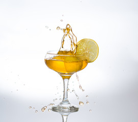 orange juice splash in a glass