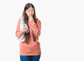 Young Chinese woman over isolated background wearing sport sweathshirt serious face thinking about question, very confused idea