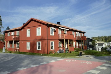 Scandinavian housing, classic red villa with blue sky