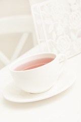 White background with a cup of tea