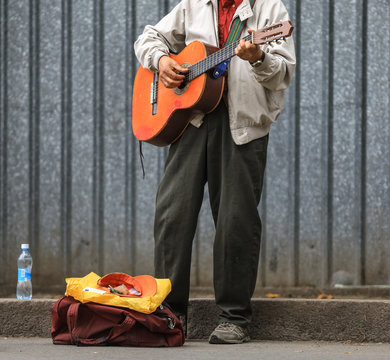 Poor Street Guitarist