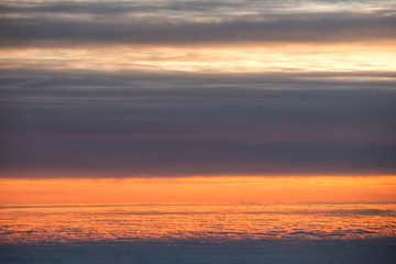 Fototapeta na wymiar Skyline View above clouds from plane