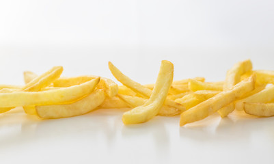 strip of french fries on white background
