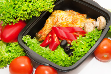 Chicken with lettuce and vegetables in lunchbox