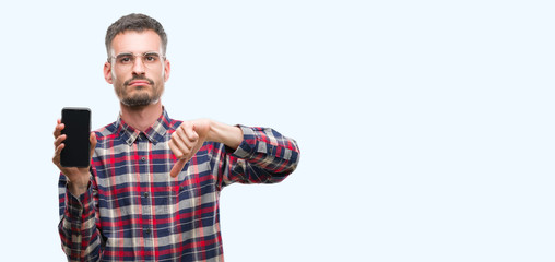 Young hipster adult man talking on the phone with angry face, negative sign showing dislike with thumbs down, rejection concept