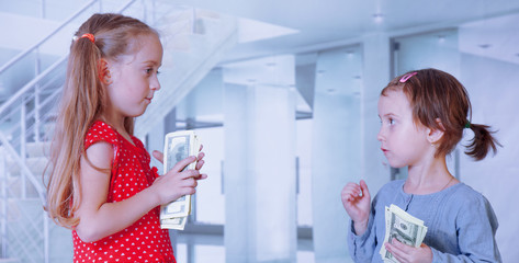 Two business children with US Dollars making a deal.