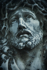 Fototapeta na wymiar Close up of antique statue Jesus Christ as a symbol of love, faith and religion.