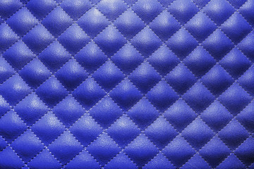 Blue quilted leather. Stylish background pattern.
