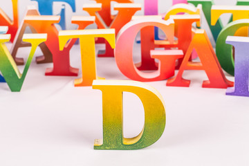 colorful uppercase english letters on white background.