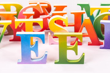 colorful uppercase english letters on white background.