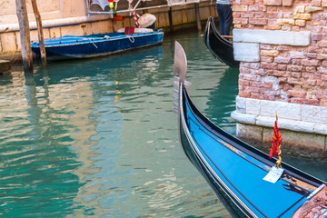 Fototapeta na wymiar gondola in the narrow canals of Venice, Italy