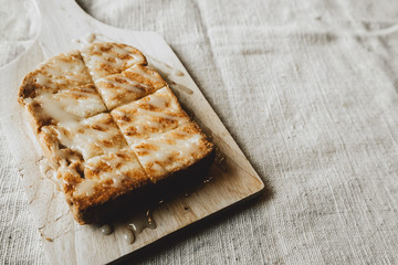 Toast with Sweetened condensed milk on a cutting board
