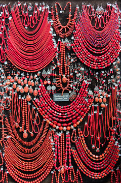 Assorted red Bamboo Coral jewelry on display at a local jewelry store.