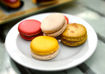 sweet macarons on white plate