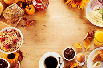 Seasonal autumn breakfast food frame on wood