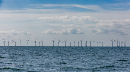 Windmills in the sea. Green power. Sustainability
