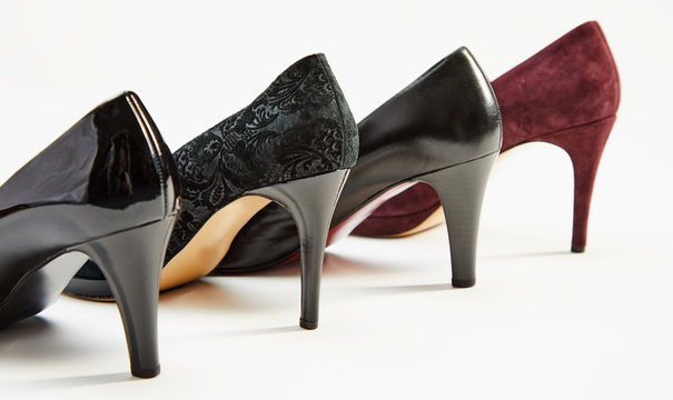 Stiletto heels on a row of ladies shoes