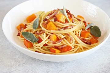 Pumpkin pasta. Spaghetti with roasted pumpkin, crispy bacon strips and sage liaves. 
