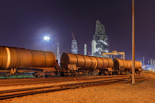 Train wagons at an oil refinery at night, Port of Antwerp, Belgium