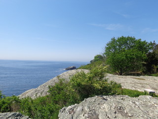 Scenic view of sky, rocks, and water on a spring day.    


