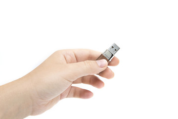flash drive in woman's hand on white background. Female's hand holding flash drive.