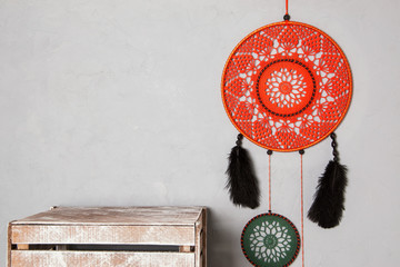 Dream catcher on gray background.