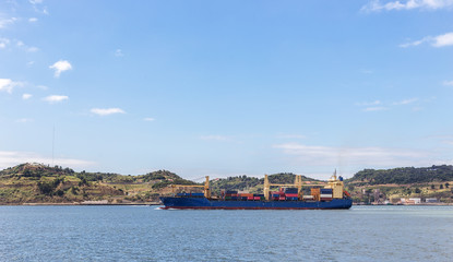 Fototapeta premium Marine industrial trailer tanker, crosses the river Tagus. Tejo
