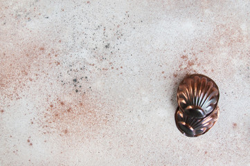 Vintage copper molds on a concrete background.