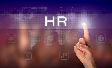A hand selecting a HR business concept on a clear screen with a colorful blurred background.