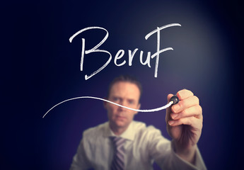 A businessman writing a Job "Beruf" concept in German with a white pen on a clear screen.