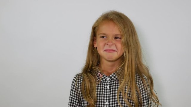 The concept of air pollution. The girl sniffs the air and closes her nose.